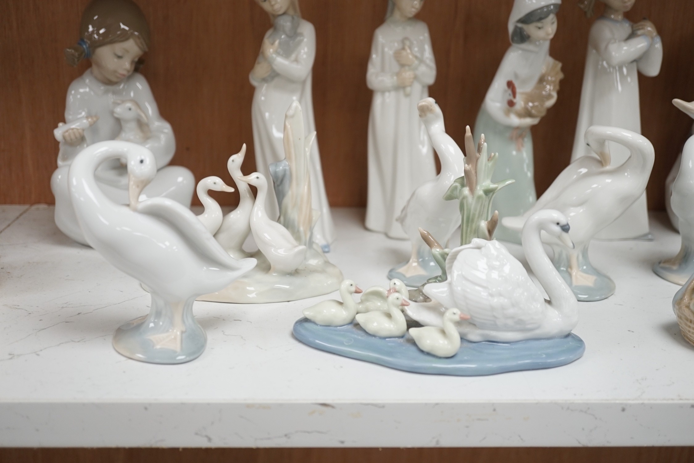 Lladro figurines, models of ducks and six Nao figurines and ducks and an unmarked model of ducks